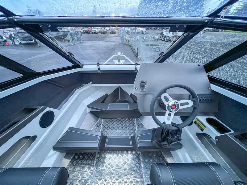 Slide: The Image of 2024 Stabicraft 1850 Fisher boat interior with steering wheel and seating. - 5