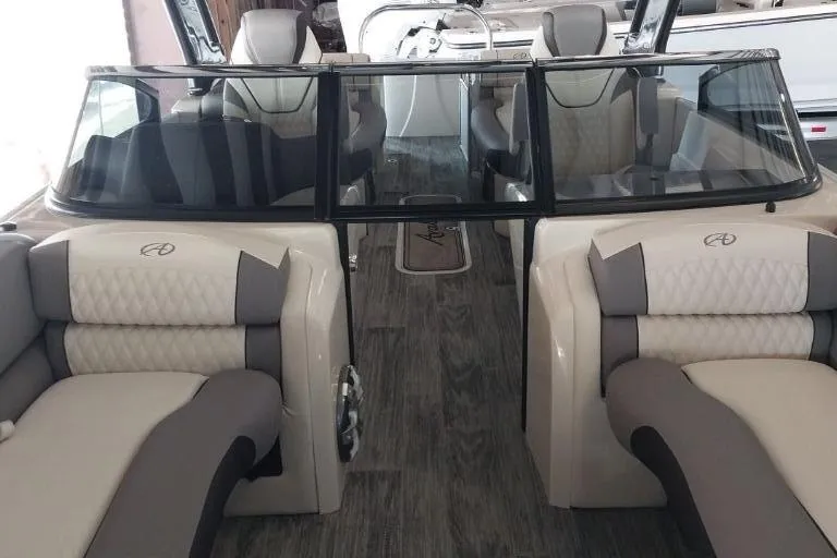 Slide: The Image of 2023 Avalon Excalibur Quad Lounge Windshield boat with sleek design and modern features. - 14