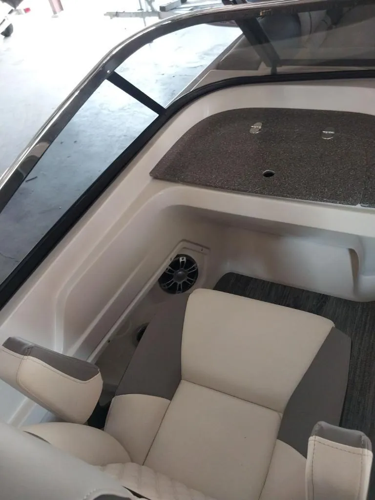 Slide: The Image of 2023 Avalon Excalibur Quad Lounge Windshield interior with seating and speaker. - 19
