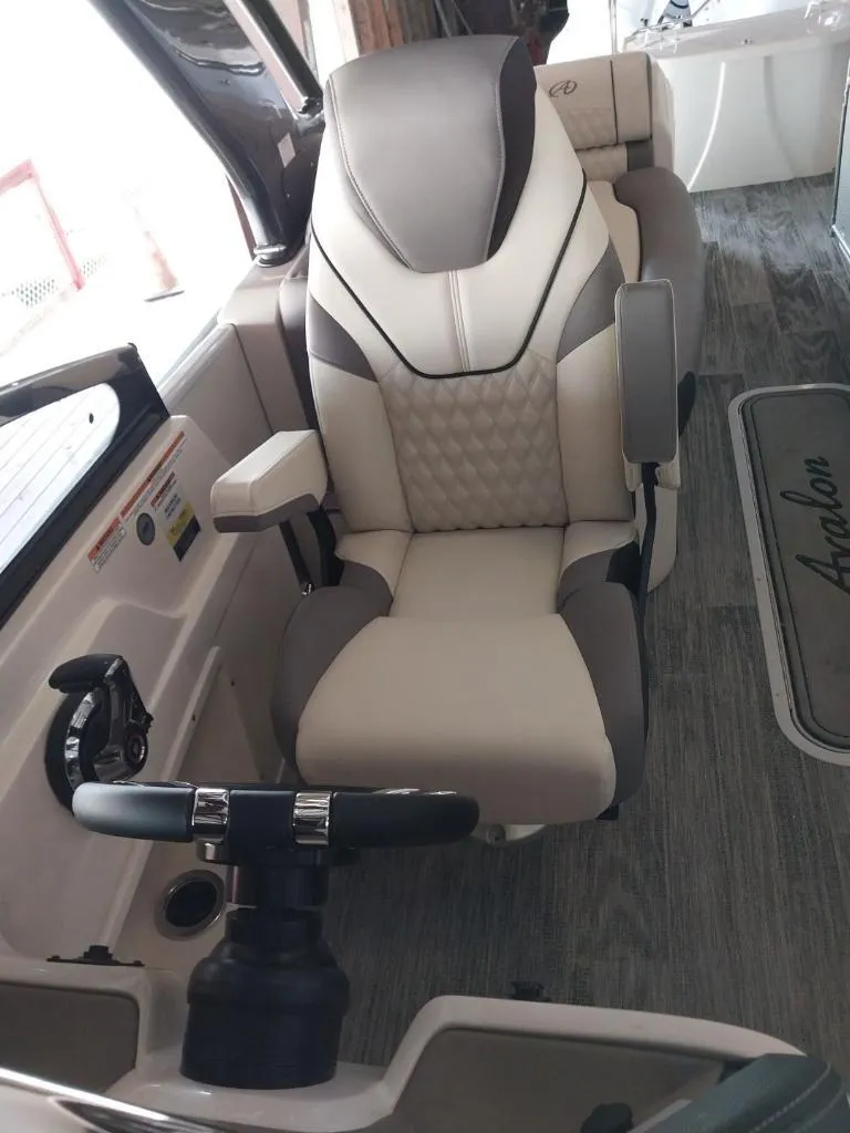 Slide: The Image of 2023 Avalon Excalibur Quad Lounge Windshield captain's chair and steering wheel. - 20
