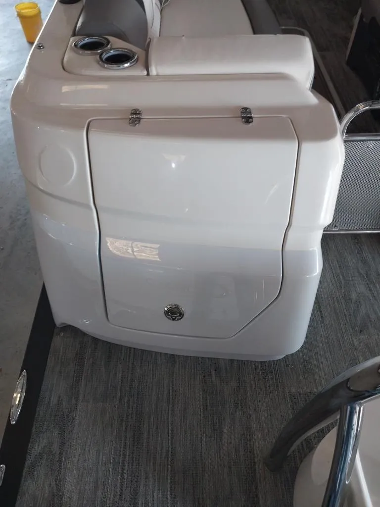 Slide: The Image of 2023 Avalon Excalibur Quad Lounge Windshield boat interior with seating and cup holders. - 25