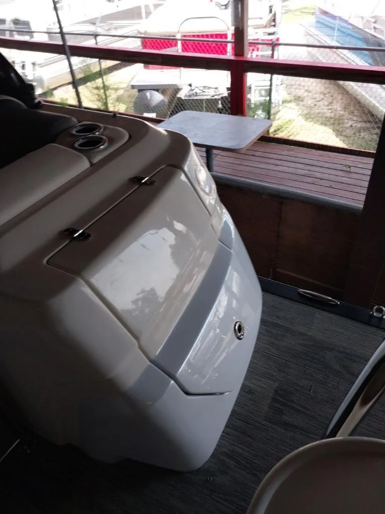 Slide: The Image of 2023 Avalon Excalibur Quad Lounge Windshield boat interior with seating and storage. - 26