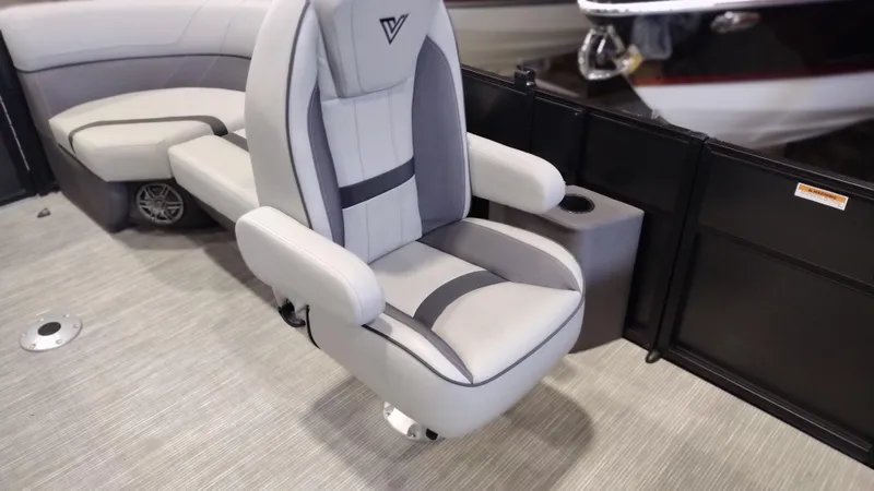 Slide: The Image of 2024 Viaggio Lago X18U boat interior with plush captain's chair and cup holder. - 11