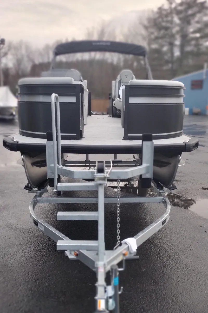 Slide: The Image of 2024 Viaggio Lago X18U pontoon boat on a trailer, ready for transport. - 22