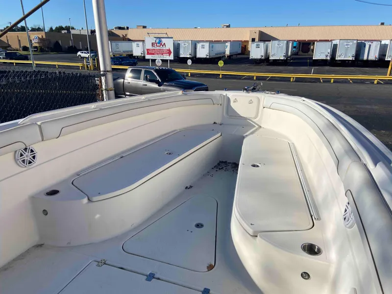 Slide: The Image of 2014 Wellcraft 35 Scarab Tournament boat interior with seating and storage compartments. - 11