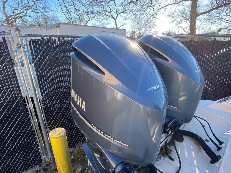 Slide: The Image of Twin Yamaha outboard engines on a 2014 Wellcraft 35 Scarab Tournament boat. - 13