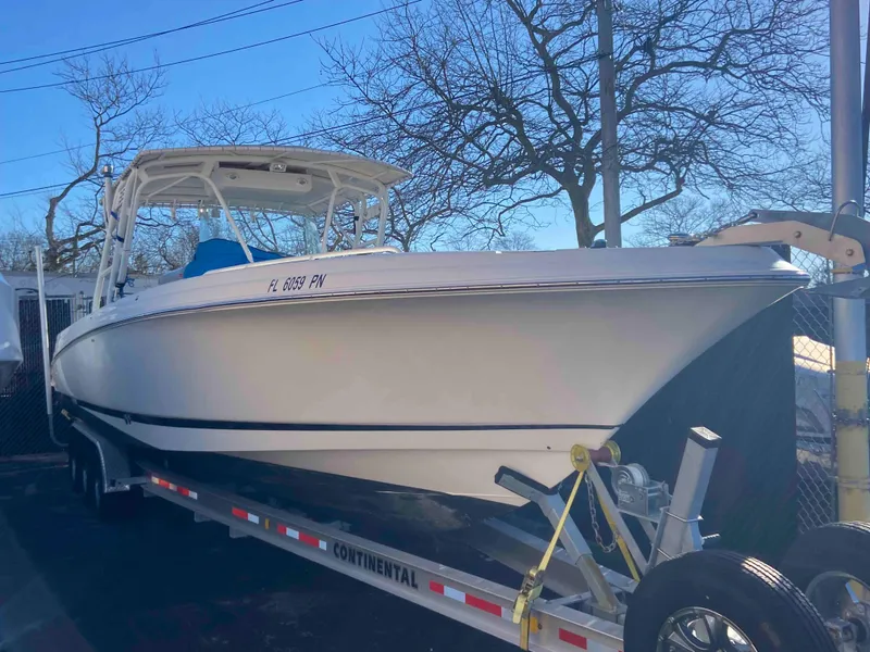 Slide: The Image of 2014 Wellcraft 35 Scarab Tournament boat on a trailer. - 4