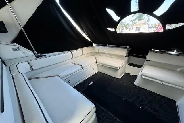 Slide: The Image of 1988 Chris-Craft Amerosport boat interior with white seating and black canopy. - 17
