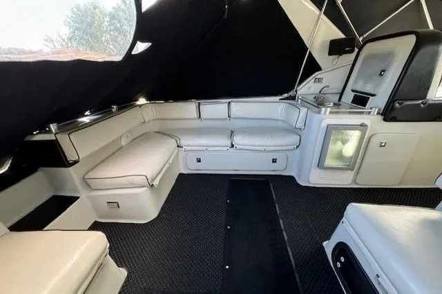 Slide: The Image of Interior of 1988 Chris-Craft Amerosport boat with white seating and black carpet. - 19