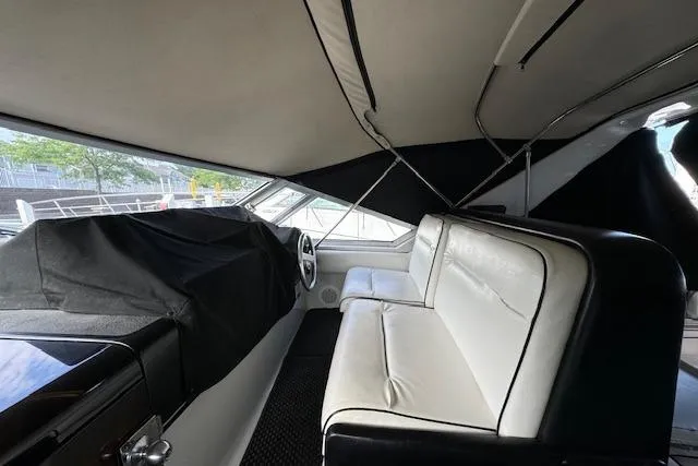 Slide: The Image of Interior of 1988 Chris-Craft Amerosport boat with white seating and covered dashboard. - 20