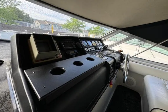 Slide: The Image of 1988 Chris-Craft Amerosport boat dashboard with gauges and controls. - 26