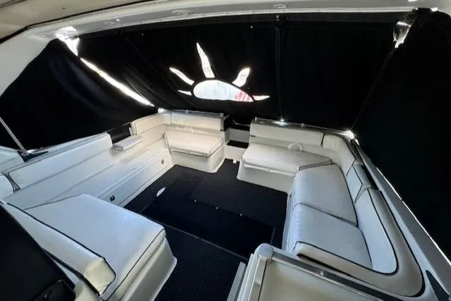 Slide: The Image of Interior of 1988 Chris-Craft Amerosport boat with white seating and black curtains. - 29
