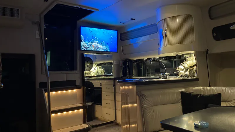 Slide: The Image of 1988 Chris-Craft Amerosport yacht interior with modern lighting and TV. - 33