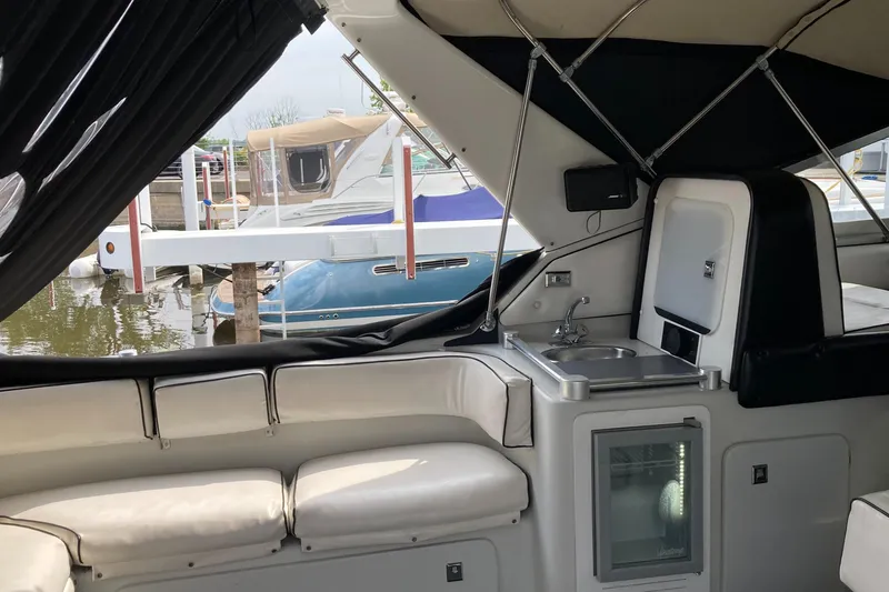 Slide: The Image of Interior of a 1988 Chris-Craft Amerosport boat with white seating and a small sink. - 40
