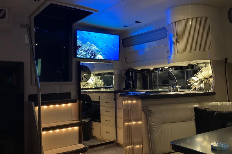 Slide: The Image of 1988 Chris-Craft Amerosport yacht interior with modern lighting and TV. - 41