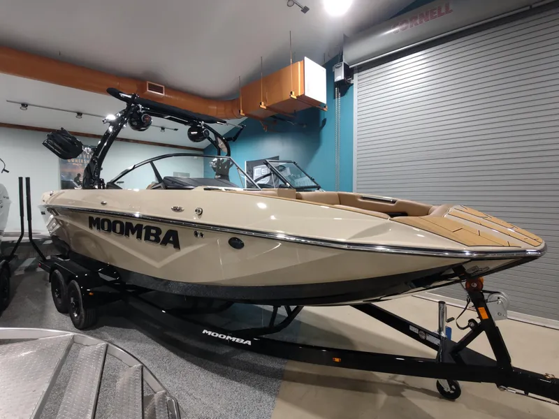 Slide: The Image of 2024 Moomba Makai boat on trailer in indoor showroom. - 1