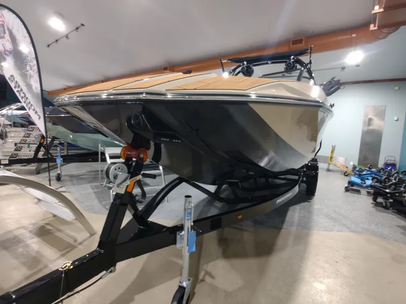 Slide: The Image of 2024 Moomba Makai boat on trailer in indoor showroom. - 10