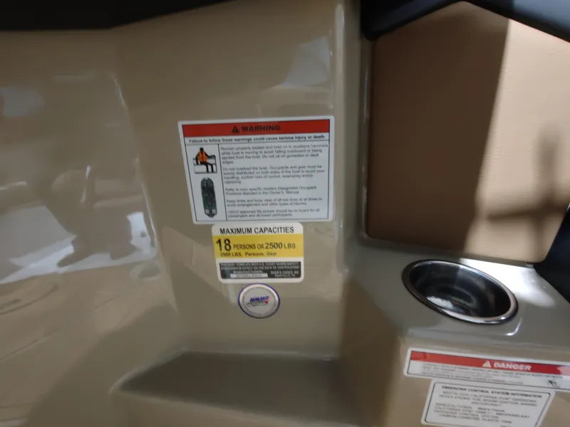 Slide: The Image of 2024 Moomba Makai boat capacity and safety warning labels. - 16