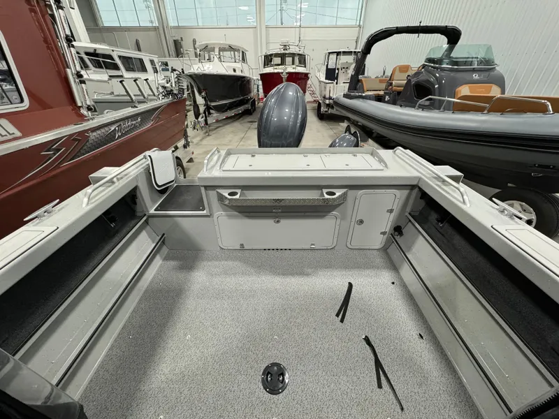 Slide: The Image of 2024 Weldcraft 200 Revolution F200 boat interior, spacious deck, in stock at showroom. - 2