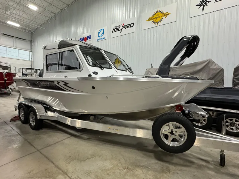 Slide: The Image of 2024 Weldcraft 200 Revolution F200 boat on trailer in showroom. - 3