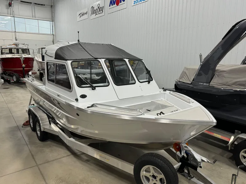 Slide: The Image of 2024 Weldcraft 200 Revolution F200 boat in stock, displayed in a showroom. - 4