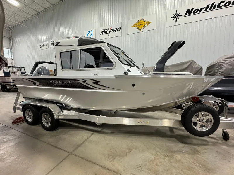Slide: The Image of 2024 Weldcraft 200 Revolution F200 boat on trailer in showroom. - 5