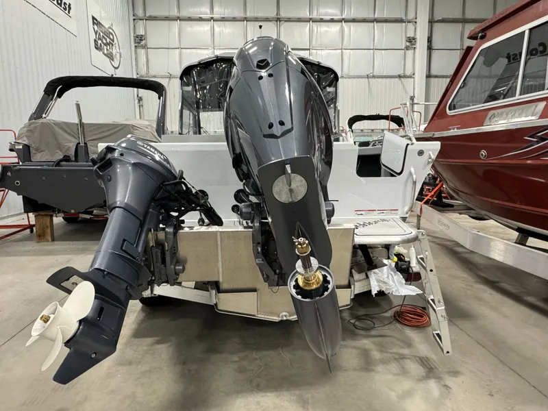 Slide: The Image of 2024 Weldcraft 200 Revolution F200 boat in stock, rear view in showroom. - 8