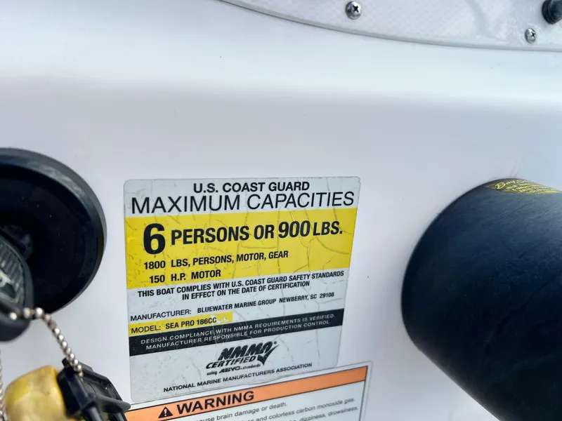 Slide: The Image of U.S. Coast Guard capacity label on a 2007 Sea Pro SP186D boat. - 10