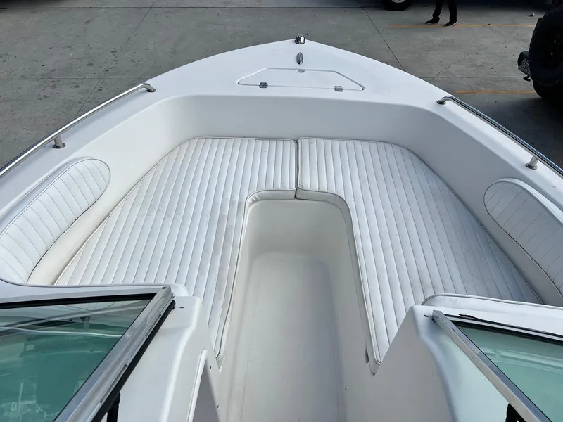 Slide: The Image of 2007 Sea Pro SP186D boat with white cushioned seating in the bow area. - 11