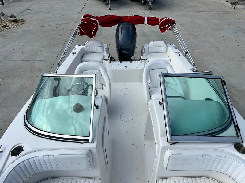 Slide: The Image of 2007 Sea Pro SP186D boat with open deck and red canopy. - 12