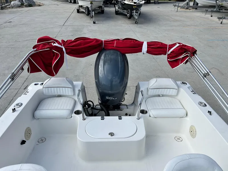 Slide: The Image of 2007 Sea Pro SP186D boat with red canopy and white seating. - 4