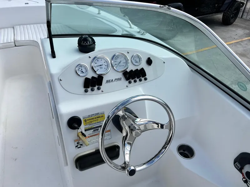 Slide: The Image of 2007 Sea Pro SP186D boat dashboard with steering wheel and gauges. - 9