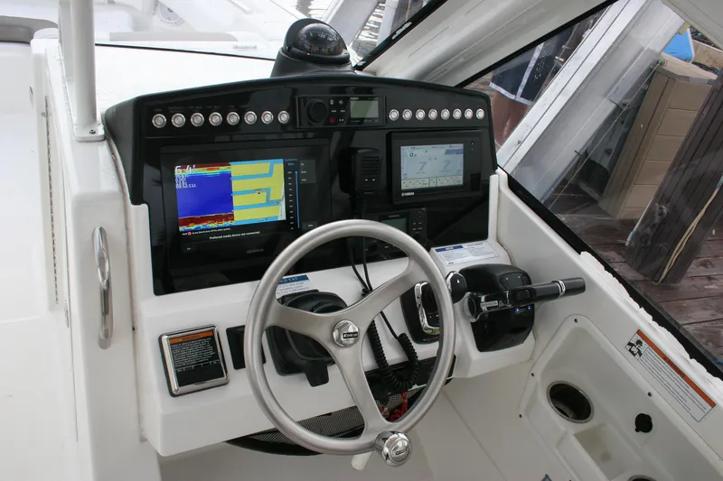 Slide: The Image of 2021 World Cat 280 DC-X helm with advanced navigation and control systems. - 10