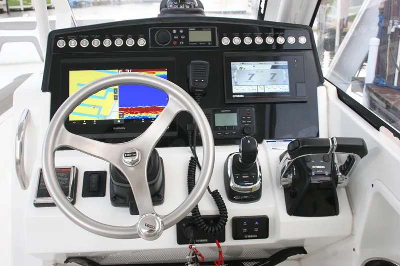 Slide: The Image of Cockpit of 2021 World Cat 280 DC-X with advanced navigation and control systems. - 11