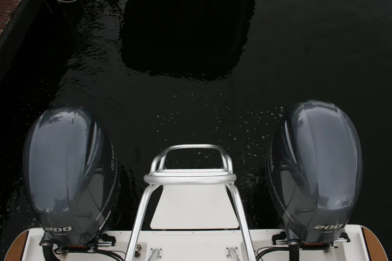 Slide: The Image of 2021 World Cat 280 DC-X boat with dual 200 horsepower engines on water. - 9