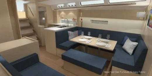 Slide: The Image of Luxurious interior of 2025 X-Yachts X-4.9 with oak furniture and navy fabric seating. - 16