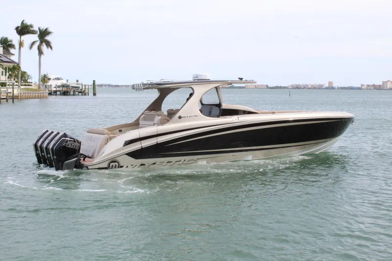 Slide: The Image of 2021 Mystic Powerboats M4200 cruising on the water. - 24