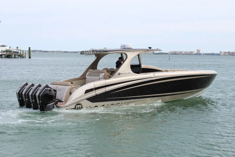 Slide: The Image of 2021 Mystic Powerboats M4200 cruising on the water. - 25