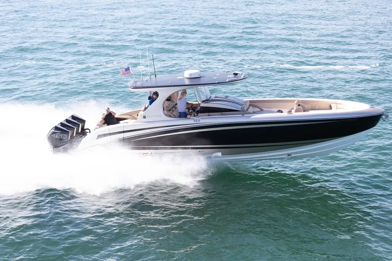 Slide: The Image of 2021 Mystic Powerboats M4200 speeding on the water. - 28