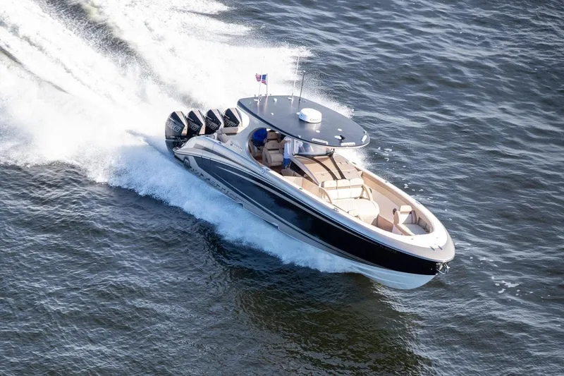 Slide: The Image of 2021 Mystic Powerboats M4200 cruising on water. - 29