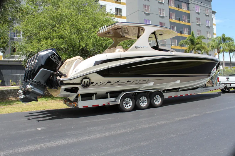 Slide: The Image of 2021 Mystic Powerboats M4200 on trailer, side view. - 30