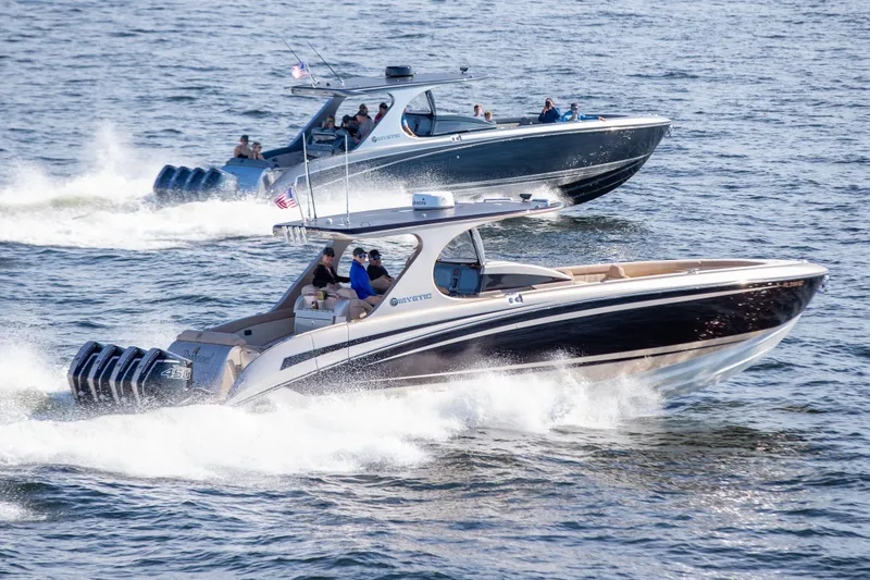 Slide: The Image of 2021 Mystic Powerboats M4200 cruising on water with passengers. - 31