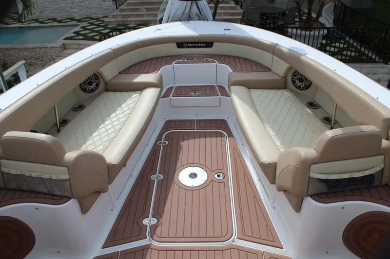 Slide: The Image of 2021 Mystic Powerboats M4200 interior with luxurious seating and teak flooring. - 34