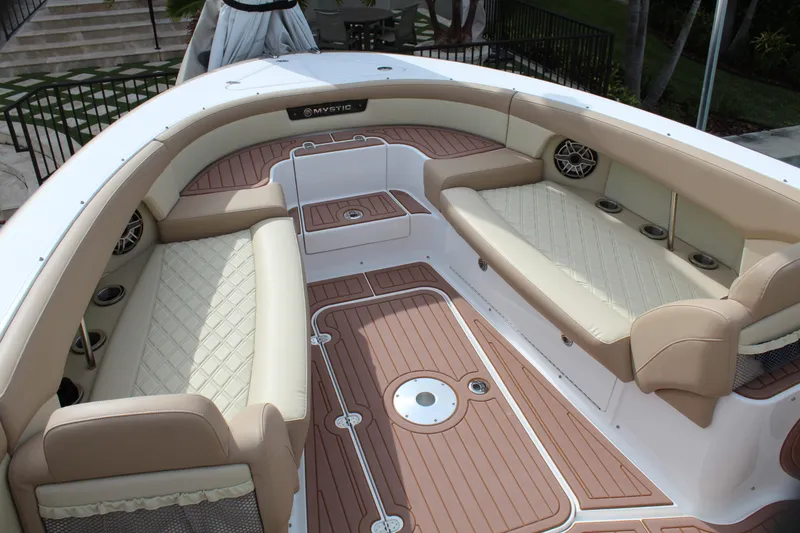 Slide: The Image of 2021 Mystic Powerboats M4200 interior with luxurious seating and teak flooring. - 35