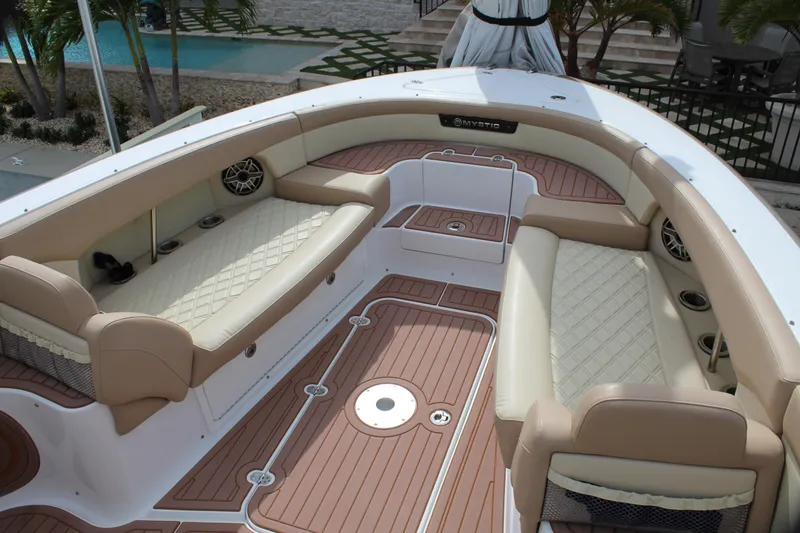 Slide: The Image of 2021 Mystic Powerboats M4200 interior with luxurious seating and teak flooring. - 36