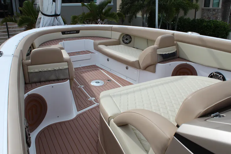 Slide: The Image of 2021 Mystic Powerboats M4200 interior with luxurious seating and teak flooring. - 37