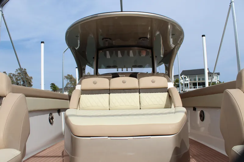 Slide: The Image of 2021 Mystic Powerboats M4200 interior seating and helm station. - 39
