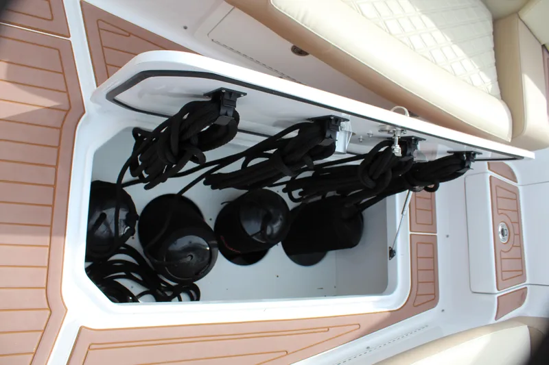 Slide: The Image of Storage compartment of a 2021 Mystic Powerboats M4200 with ropes and fenders. - 41
