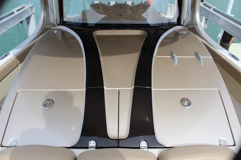 Slide: The Image of 2021 Mystic Powerboats M4200 deck with sleek design and storage compartments. - 43