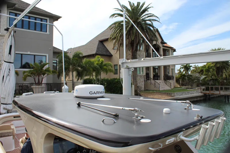 Slide: The Image of 2021 Mystic Powerboats M4200 docked near waterfront homes. - 45